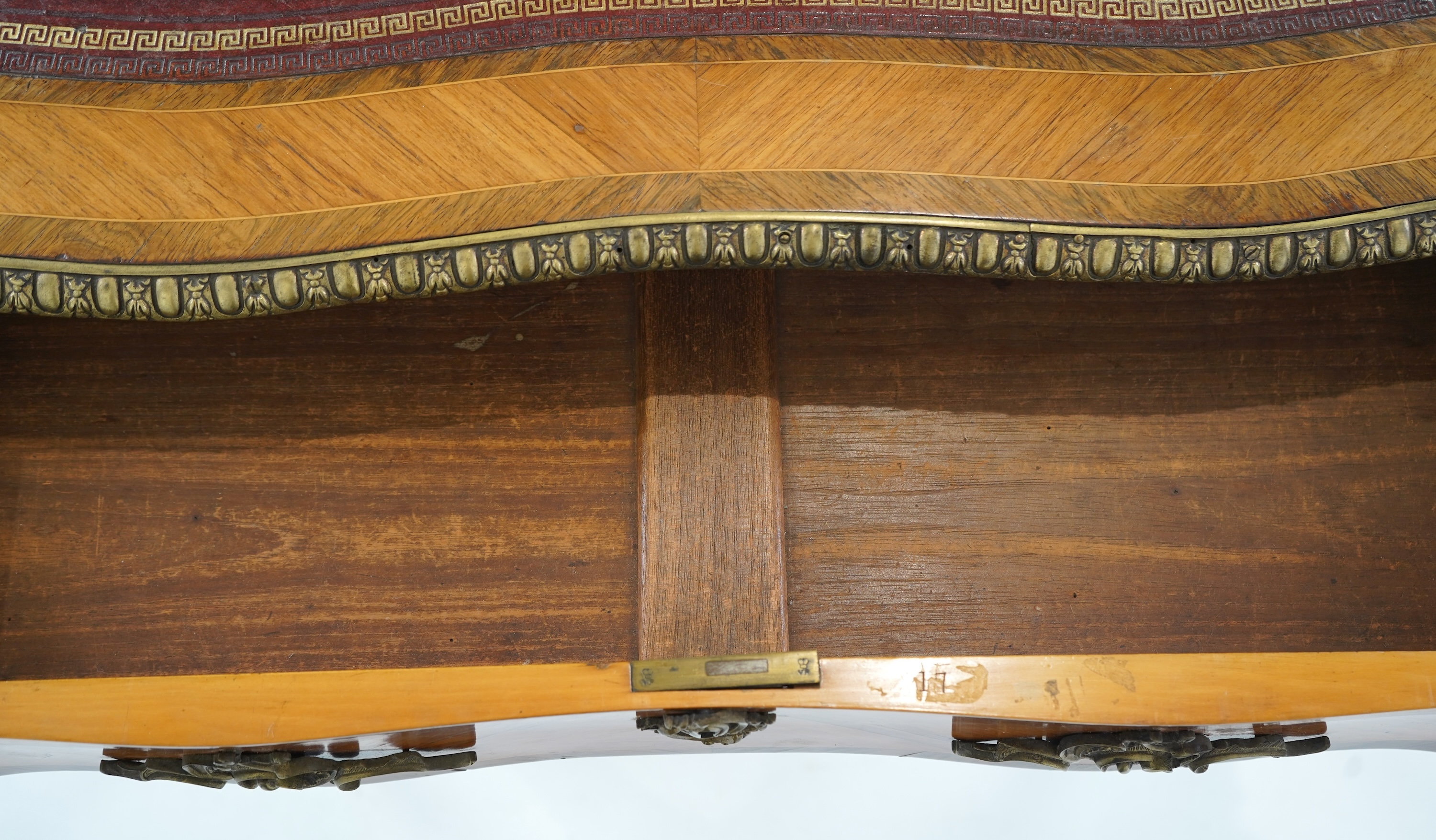 A small Louis XV style gilt metal mounted rosewood and kingwood bureau plat